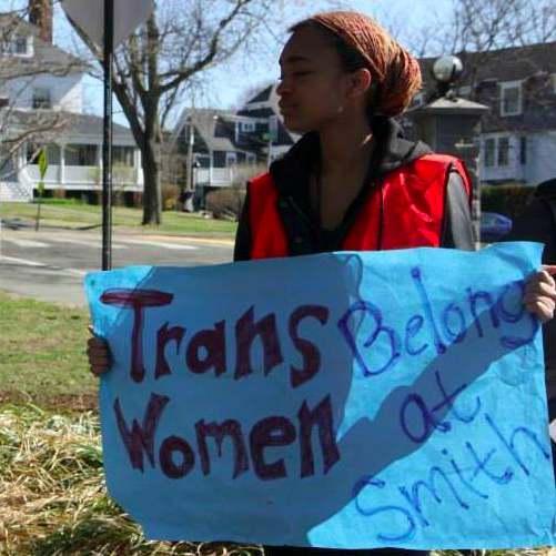 TransWomen - girl holding banner